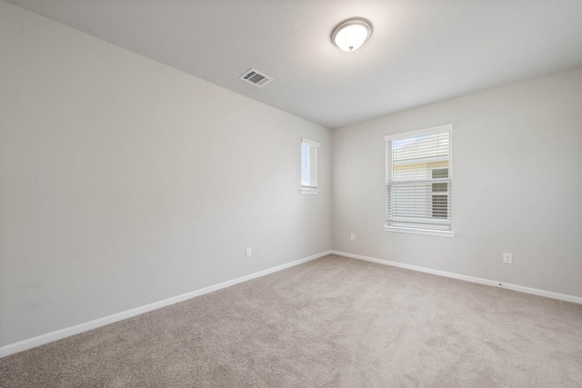 426 Emerald Thicket Ln, Huffman, TX 77336 - spare room with baseboards and light colored carpet