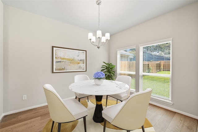 426 Emerald Thicket Ln, Huffman, TX 77336 - dining room with light wood-style floors and a chandelier