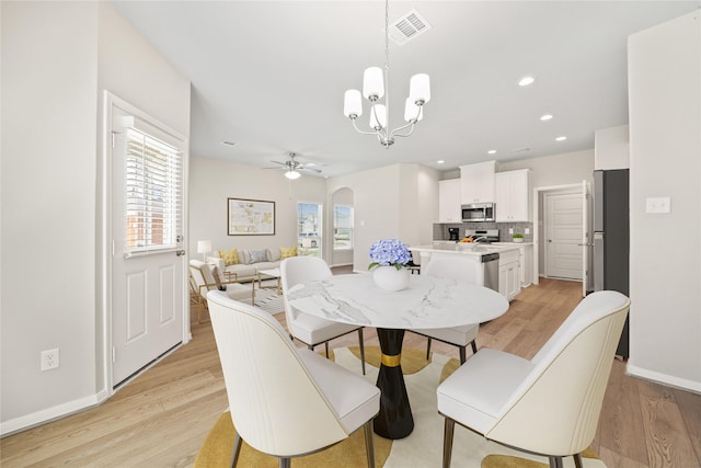 426 Emerald Thicket Ln, Huffman, TX 77336 - dining area featuring plenty of natural light, a ceiling fan, a chandelier, light wood finished floors, and recessed lighting