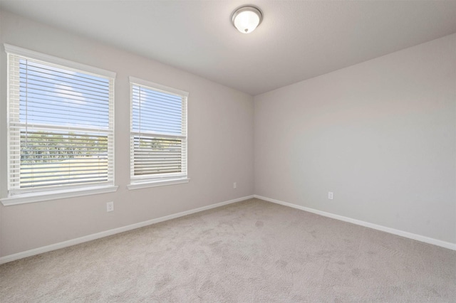 426 Emerald Thicket Ln, Huffman, TX 77336 - unfurnished room featuring carpet flooring and baseboards