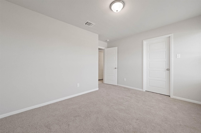 426 Emerald Thicket Ln, Huffman, TX 77336 - unfurnished bedroom with baseboards and carpet flooring