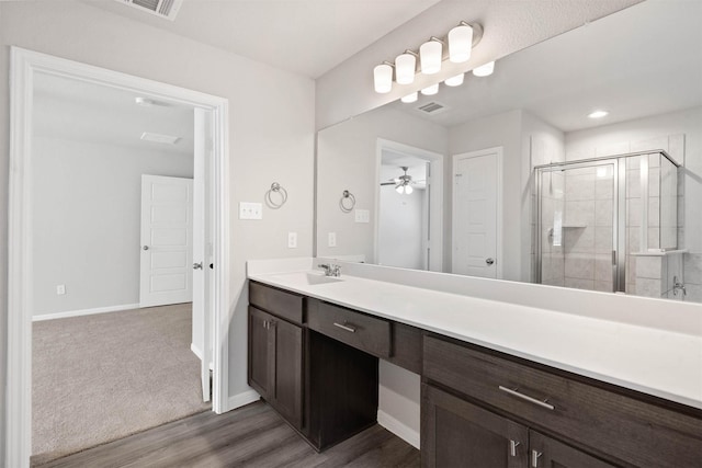 426 Emerald Thicket Ln, Huffman, TX 77336 - full bath featuring vanity, a shower stall, wood finished floors, and ceiling fan
