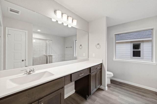 426 Emerald Thicket Ln, Huffman, TX 77336 - bathroom with vanity, a shower stall, wood finished floors, and recessed lighting