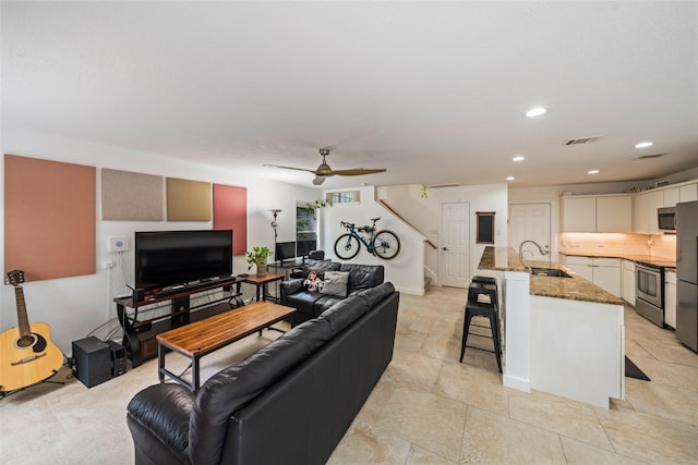 151 Anise Tree Pl, The Woodlands, TX 77382 - living room featuring stairs, a ceiling fan, recessed lighting, and light tile patterned floors
