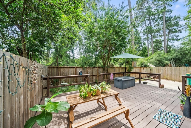 151 Anise Tree Pl, The Woodlands, TX 77382 - wooden terrace with a fenced backyard and an outdoor fire pit