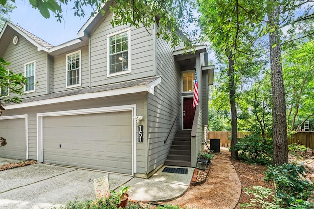151 Anise Tree Pl, The Woodlands, TX 77382 - view of front facade with an attached garage and driveway