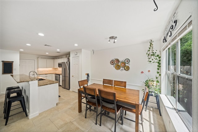 151 Anise Tree Pl, The Woodlands, TX 77382 - dining space featuring recessed lighting
