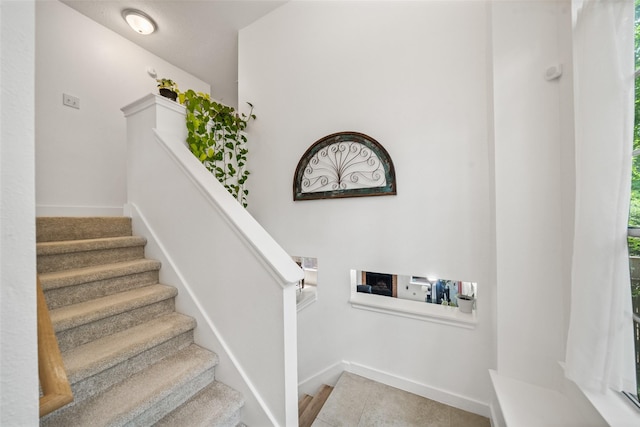 151 Anise Tree Pl, The Woodlands, TX 77382 - stairs featuring baseboards