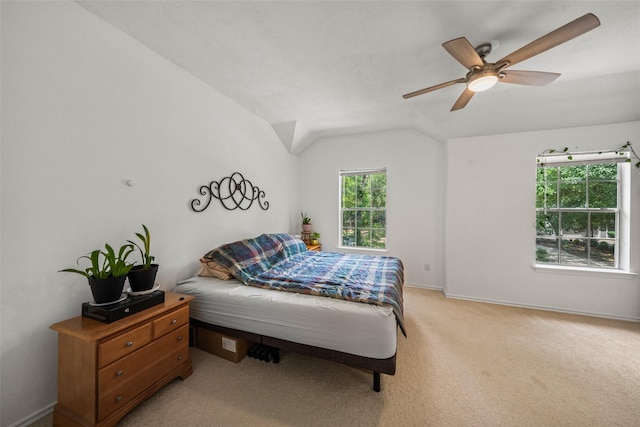 151 Anise Tree Pl, The Woodlands, TX 77382 - bedroom with light colored carpet, vaulted ceiling, and ceiling fan