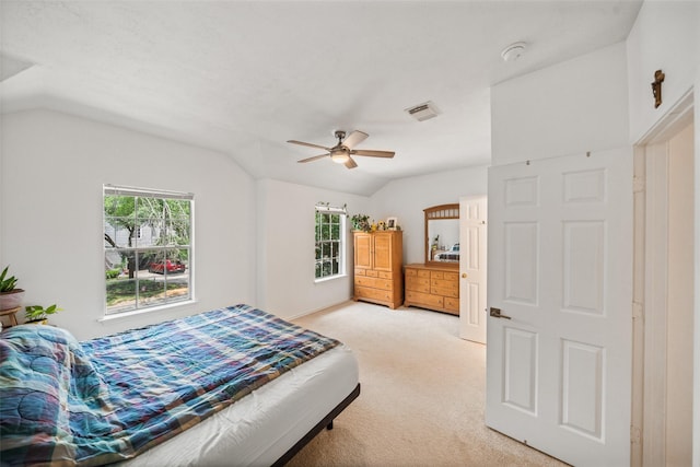 151 Anise Tree Pl, The Woodlands, TX 77382 - bedroom with vaulted ceiling, light colored carpet, and ceiling fan