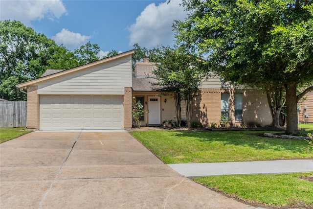 16841 Aprilmont Dr, Sugar Land, TX 77498 - mid-century home with brick siding, concrete driveway, a garage, and a chimney