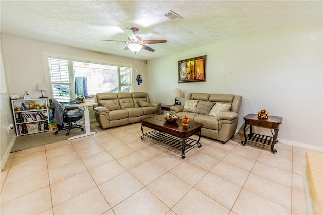 16841 Aprilmont Dr, Sugar Land, TX 77498 - living area with ceiling fan, a textured ceiling, and light tile patterned flooring