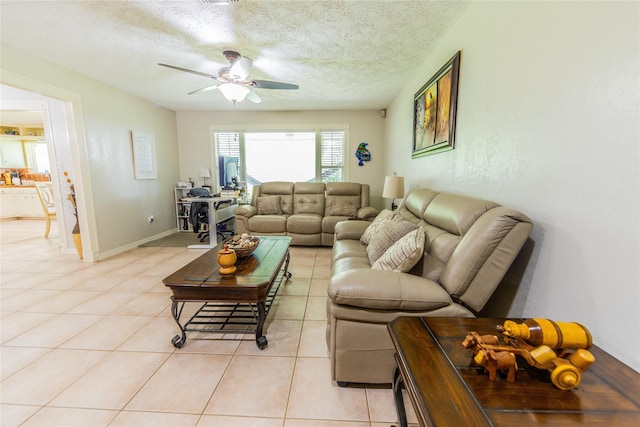 16841 Aprilmont Dr, Sugar Land, TX 77498 - living room with a ceiling fan, light tile patterned floors, and a textured ceiling