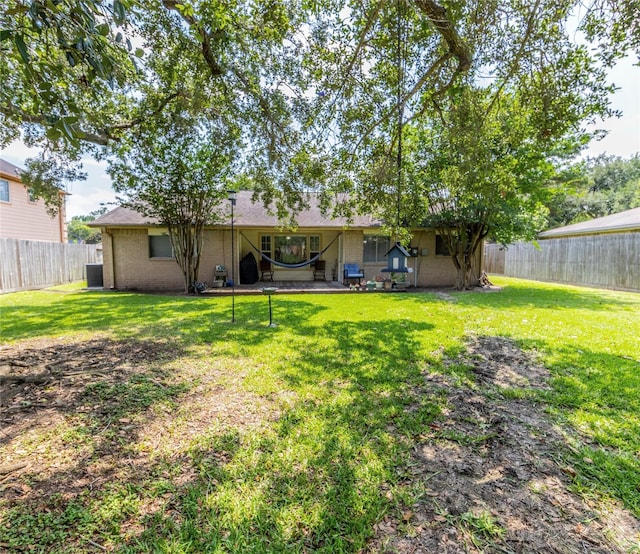 16841 Aprilmont Dr, Sugar Land, TX 77498 - rear view of property with brick siding and a fenced backyard