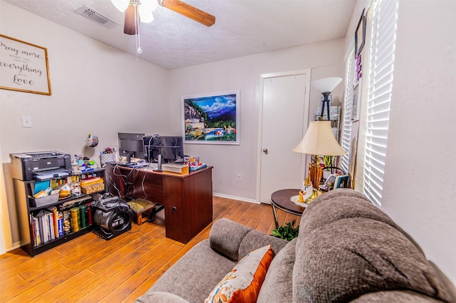 16841 Aprilmont Dr, Sugar Land, TX 77498 - office space featuring hardwood / wood-style floors, ceiling fan, and a textured ceiling