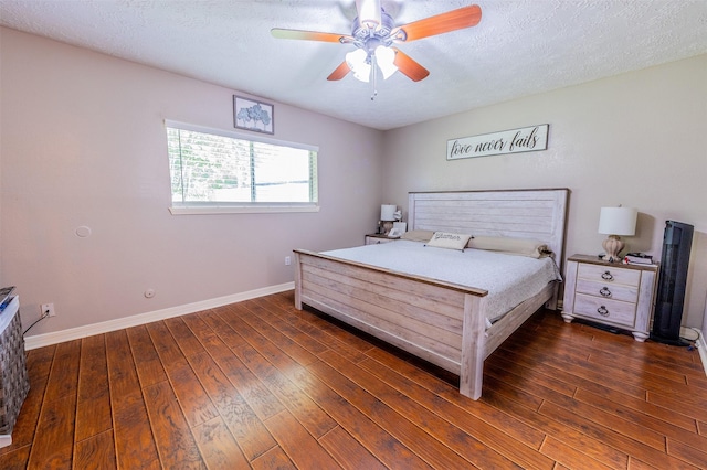 16841 Aprilmont Dr, Sugar Land, TX 77498 - bedroom featuring dark wood-style floors, ceiling fan, and a textured ceiling