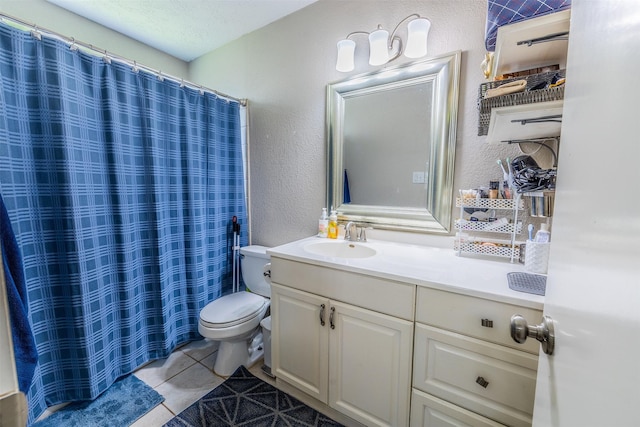 16841 Aprilmont Dr, Sugar Land, TX 77498 - bathroom with a textured wall, tile patterned flooring, vanity, and curtained shower