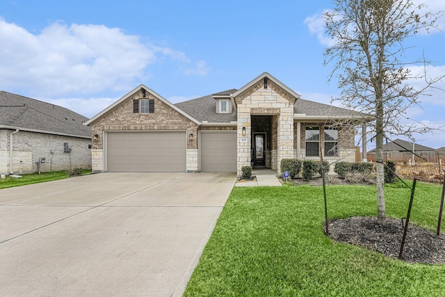 1818 Homewood Point Ln, Rosharon, TX 77583 - french country home with stone siding, a shingled roof, a front yard, an attached garage, and concrete driveway