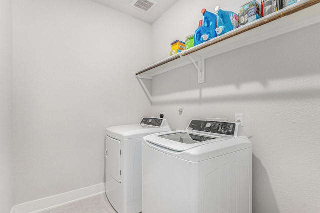 1818 Homewood Point Ln, Rosharon, TX 77583 - washroom featuring washing machine and dryer and light tile patterned floors