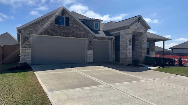 1818 Homewood Point Ln, Rosharon, TX 77583 - view of front of house featuring stone siding, driveway, a shingled roof, and an attached garage