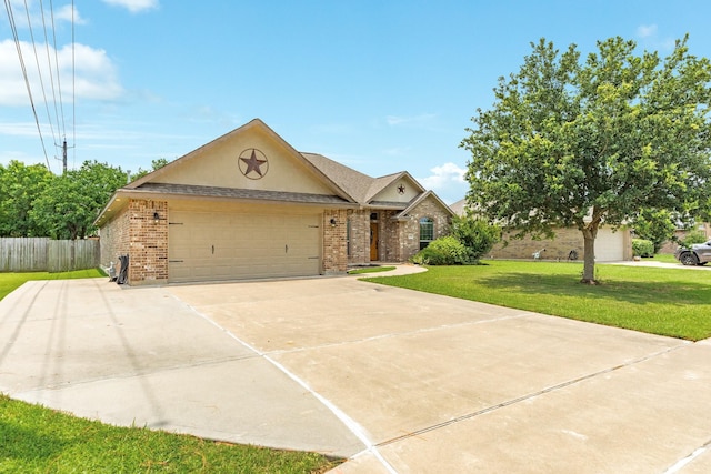203 Poppy St, Lake Jackson, TX 77566 - ranch-style home featuring brick siding, an attached garage, and concrete driveway