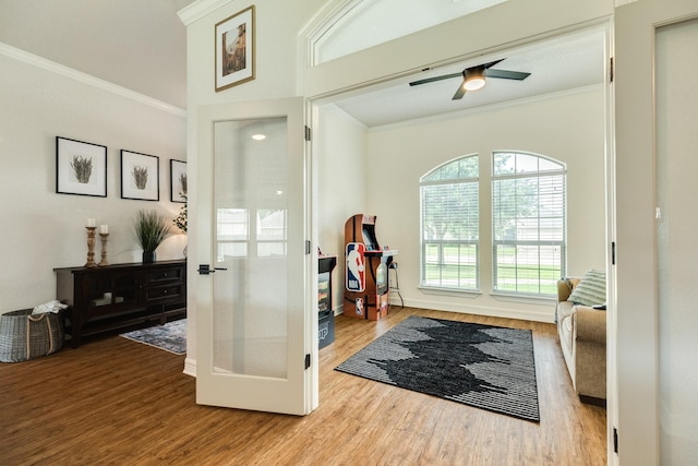 203 Poppy St, Lake Jackson, TX 77566 - entrance foyer with wood finished floors, crown molding, and ceiling fan