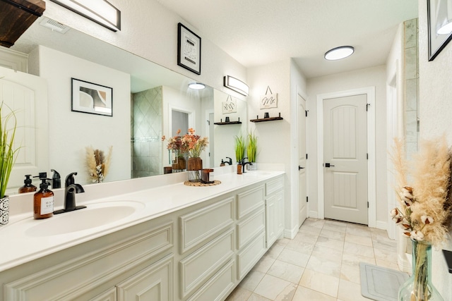 203 Poppy St, Lake Jackson, TX 77566 - full bathroom with double vanity and marble finish floors