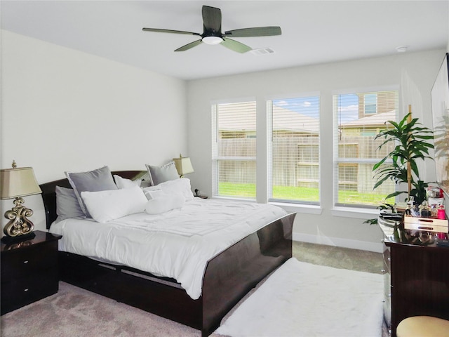7827 Albury Mnr, Richmond, TX 77407 - carpeted bedroom with multiple windows and a ceiling fan