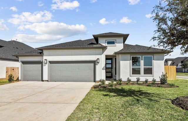 7827 Albury Mnr, Richmond, TX 77407 - prairie-style house with an attached garage, stucco siding, and concrete driveway