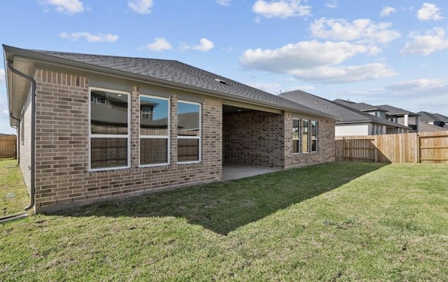 7827 Albury Mnr, Richmond, TX 77407 - rear view of house with brick siding and roof with shingles