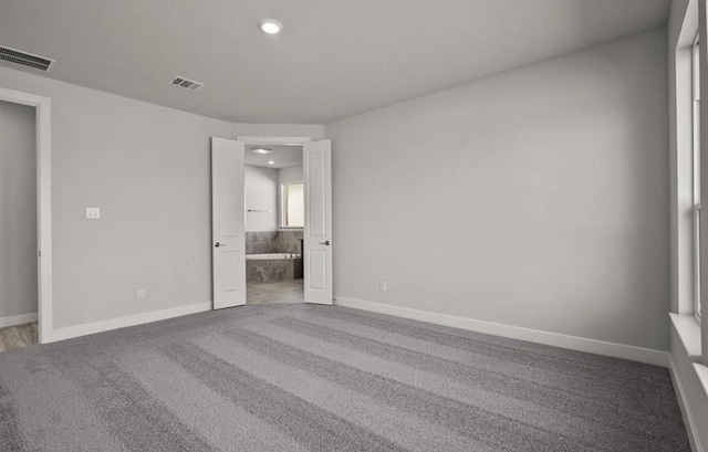 7827 Albury Mnr, Richmond, TX 77407 - unfurnished bedroom with carpet floors, recessed lighting, and ensuite bathroom
