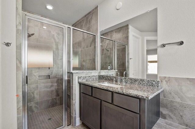 7827 Albury Mnr, Richmond, TX 77407 - bathroom featuring vanity and a stall shower