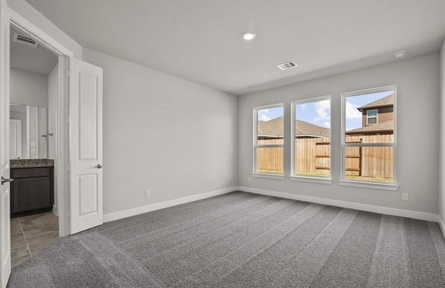 7827 Albury Mnr, Richmond, TX 77407 - empty room featuring carpet flooring and recessed lighting