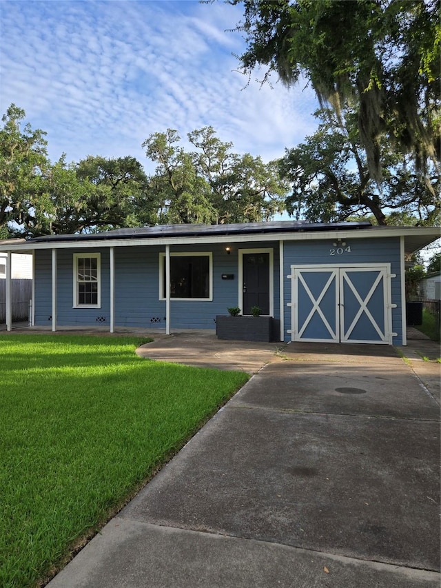 204 Jasmine St, Lake Jackson, TX 77566 - ranch-style house featuring a front yard