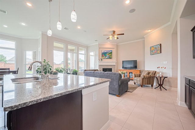 25603 Kearsley Dr, Katy, TX 77494 - kitchen featuring healthy amount of natural light, ceiling fan, crown molding, light tile patterned flooring, and recessed lighting