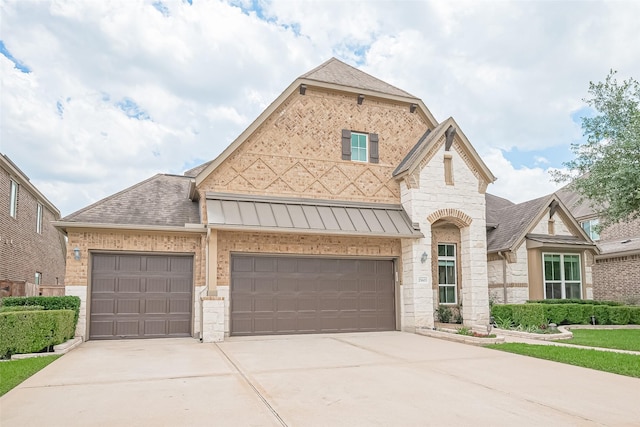 25603 Kearsley Dr, Katy, TX 77494 - french country home with driveway, a standing seam roof, a shingled roof, and stone siding