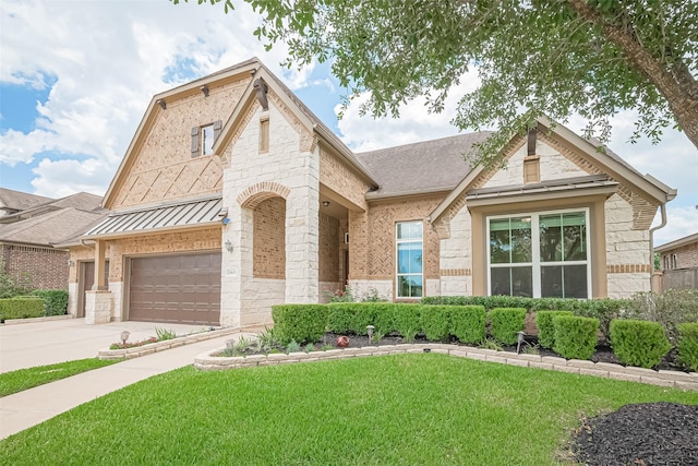 25603 Kearsley Dr, Katy, TX 77494 - french country home with a front lawn, stone siding, driveway, a standing seam roof, and a garage