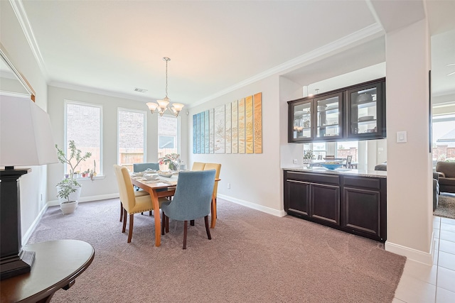 25603 Kearsley Dr, Katy, TX 77494 - dining room featuring a chandelier, crown molding, and light carpet