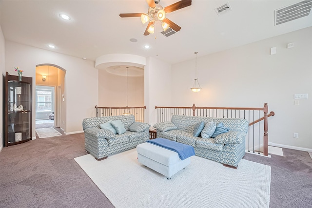 25603 Kearsley Dr, Katy, TX 77494 - living room featuring ceiling fan, carpet floors, arched walkways, and recessed lighting