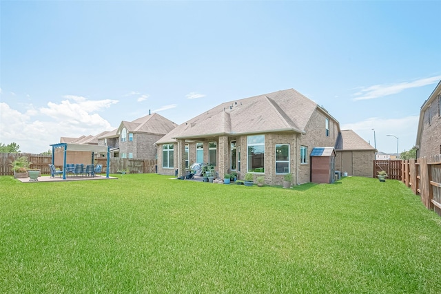 25603 Kearsley Dr, Katy, TX 77494 - rear view of house featuring a patio area, a fenced backyard, and brick siding