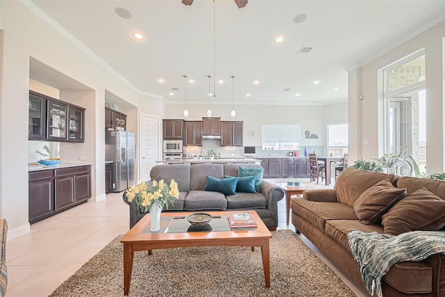 25603 Kearsley Dr, Katy, TX 77494 - living area with light tile patterned floors, recessed lighting, ornamental molding, and a ceiling fan