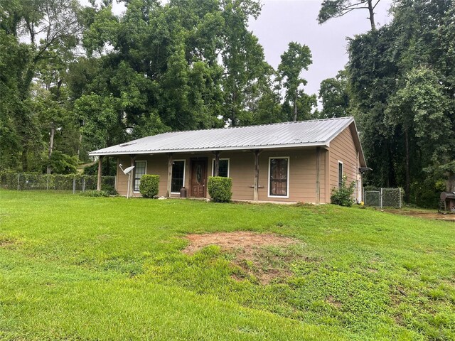521 Northwood Dr, Point Blank, TX 77364 - single story home with covered porch and a metal roof