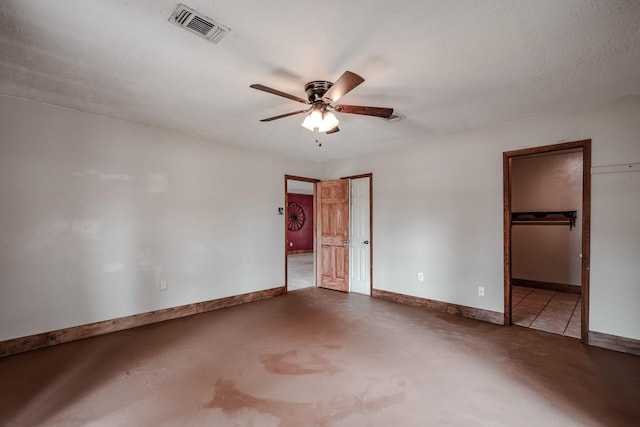 521 Northwood Dr, Point Blank, TX 77364 - unfurnished bedroom featuring concrete floors, ceiling fan, and connected bathroom
