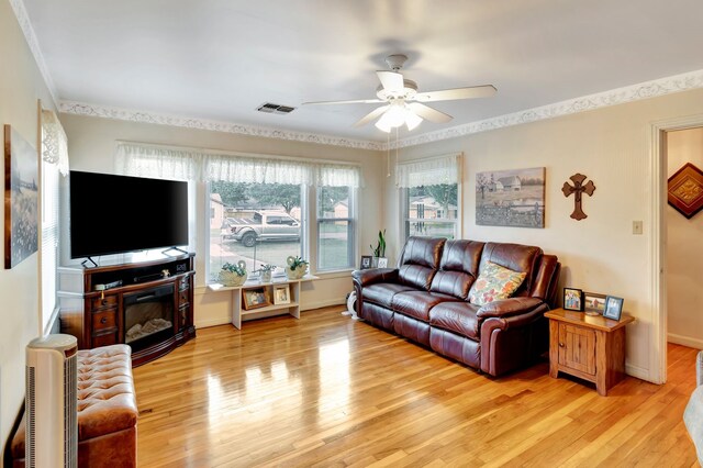 820 Meadow Ln, Wharton, TX 77488 - living area featuring ceiling fan and light wood-type flooring
