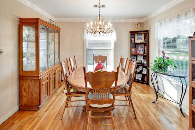 820 Meadow Ln, Wharton, TX 77488 - dining room with a chandelier and light wood-type flooring