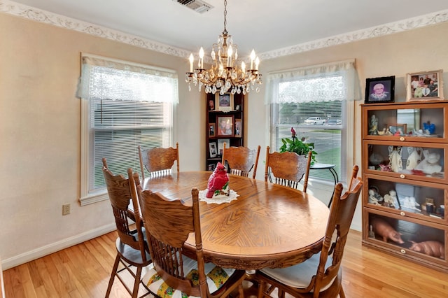 820 Meadow Ln, Wharton, TX 77488 - dining area featuring a chandelier and light wood finished floors