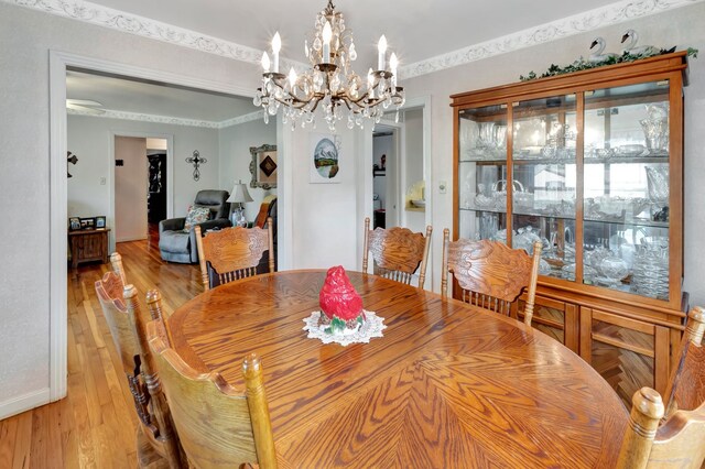 820 Meadow Ln, Wharton, TX 77488 - dining space featuring a chandelier and light wood-type flooring