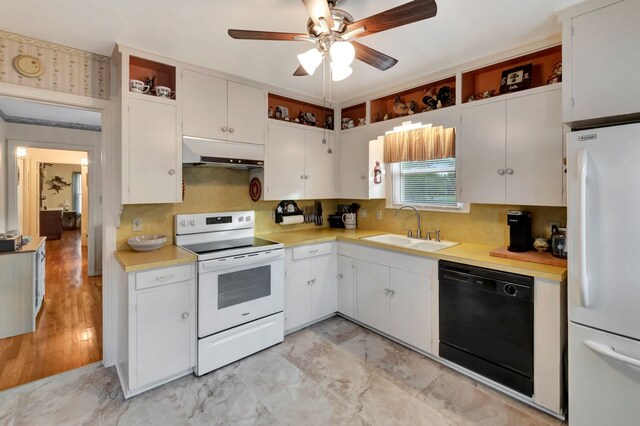 820 Meadow Ln, Wharton, TX 77488 - kitchen with white appliances, extractor fan, open shelves, and light countertops