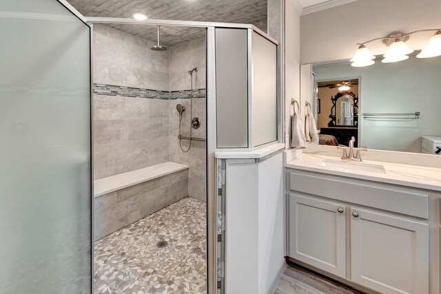 820 Meadow Ln, Wharton, TX 77488 - ensuite bathroom featuring a stall shower, vanity, a ceiling fan, and crown molding