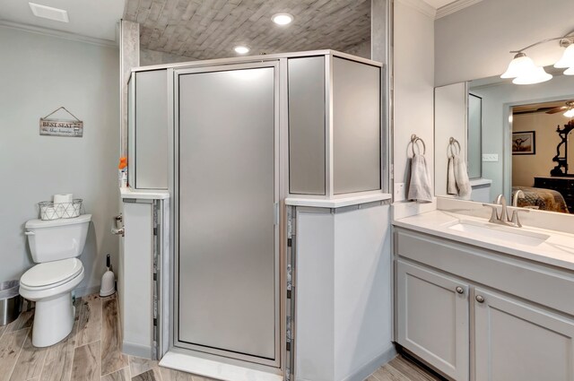 820 Meadow Ln, Wharton, TX 77488 - full bathroom with crown molding, vanity, a shower stall, ceiling fan, and connected bathroom